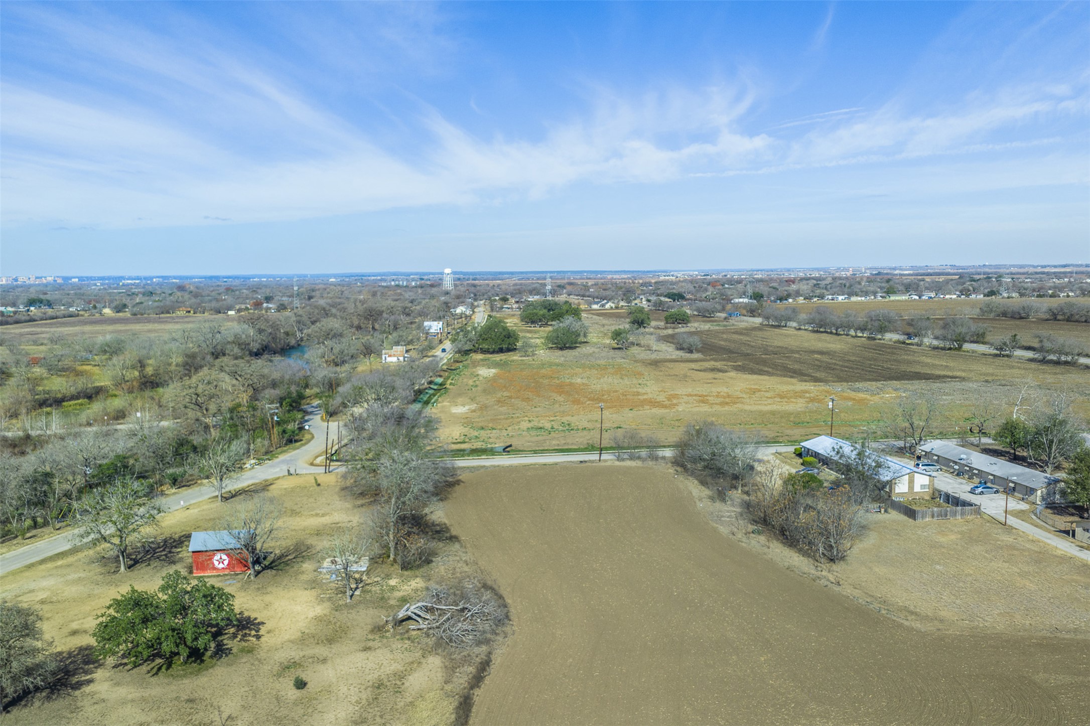 333 Quail Run Road Martindale, TX 78655 - Photo 2 of 9 a view of a lake with a mountain