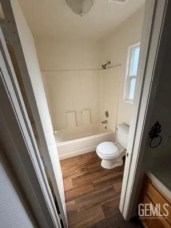 a spacious bathroom with a double vanity sink and a mirror