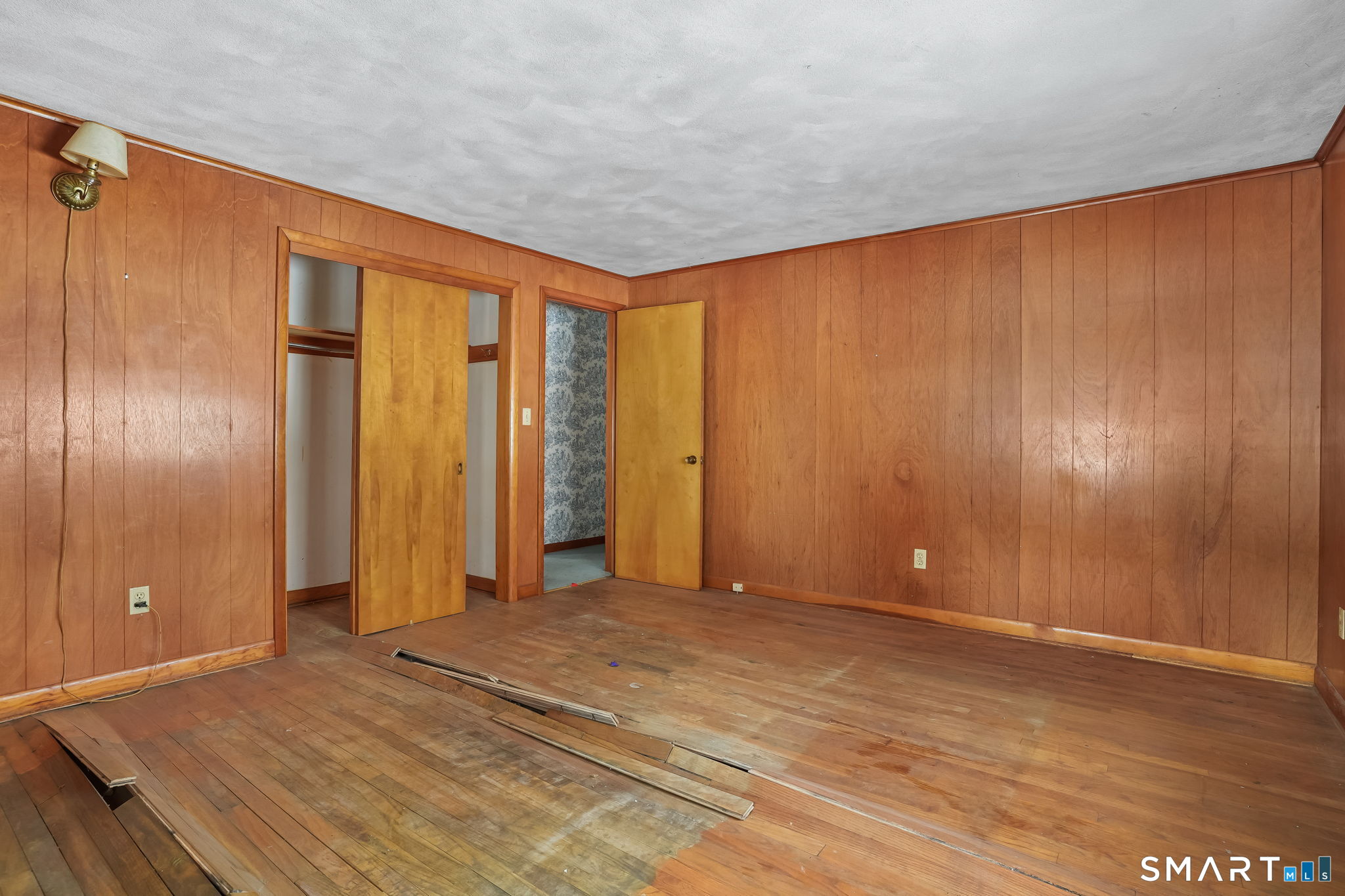 10 Pasture Lane Simsbury, CT 06092 - Photo 24 of 40 a view of an empty room with wooden floor and a window
