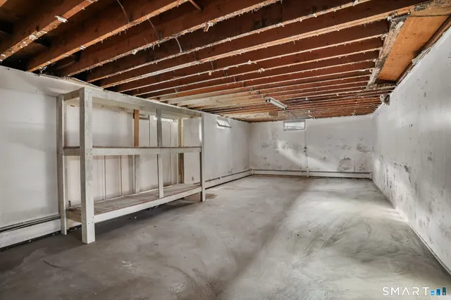 a white toilet sitting next to a bathroom sink