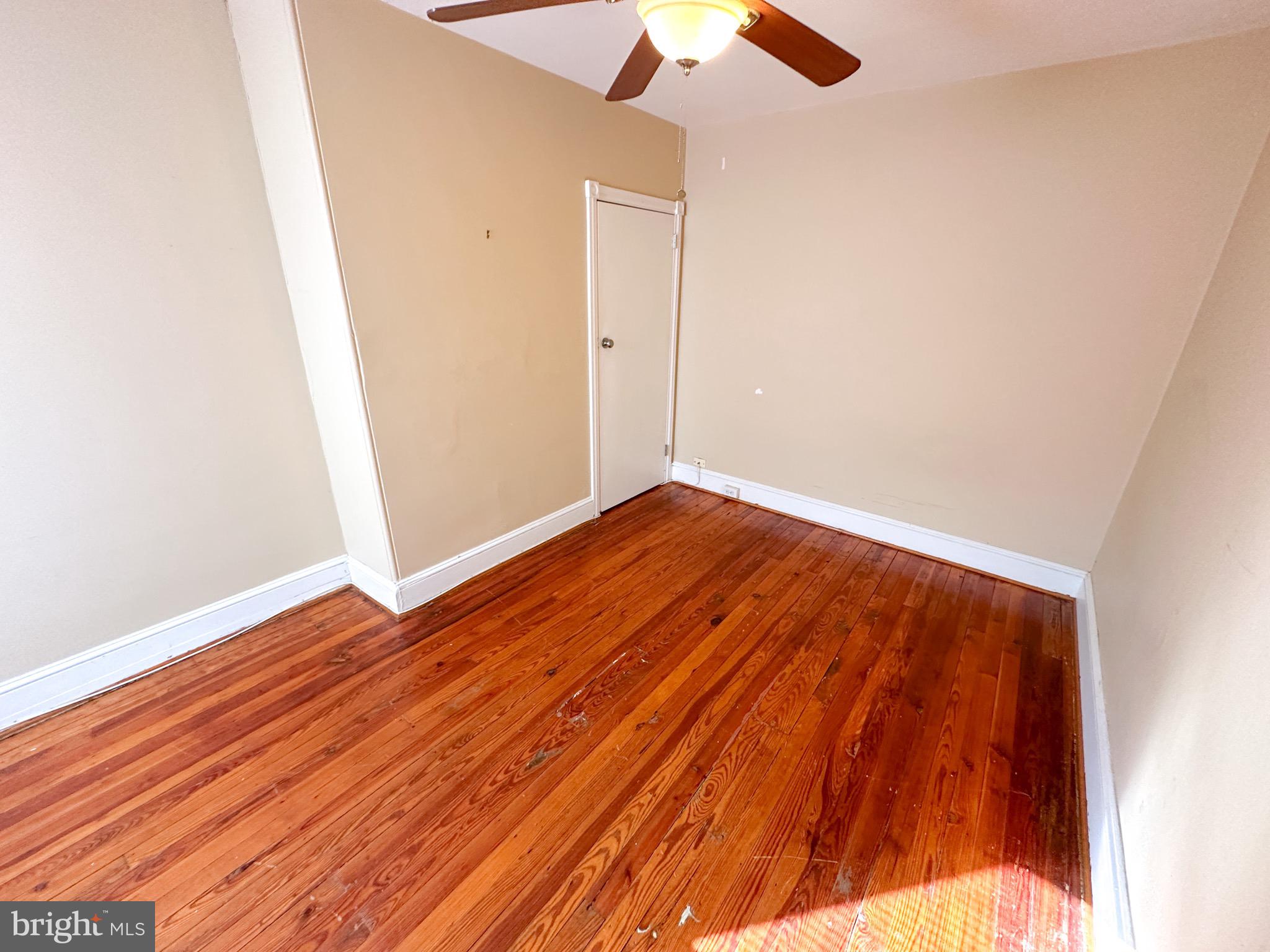 437 Markle Street Philadelphia, PA 19128 - Photo 11 of 20 an empty room with wooden floor fan and window