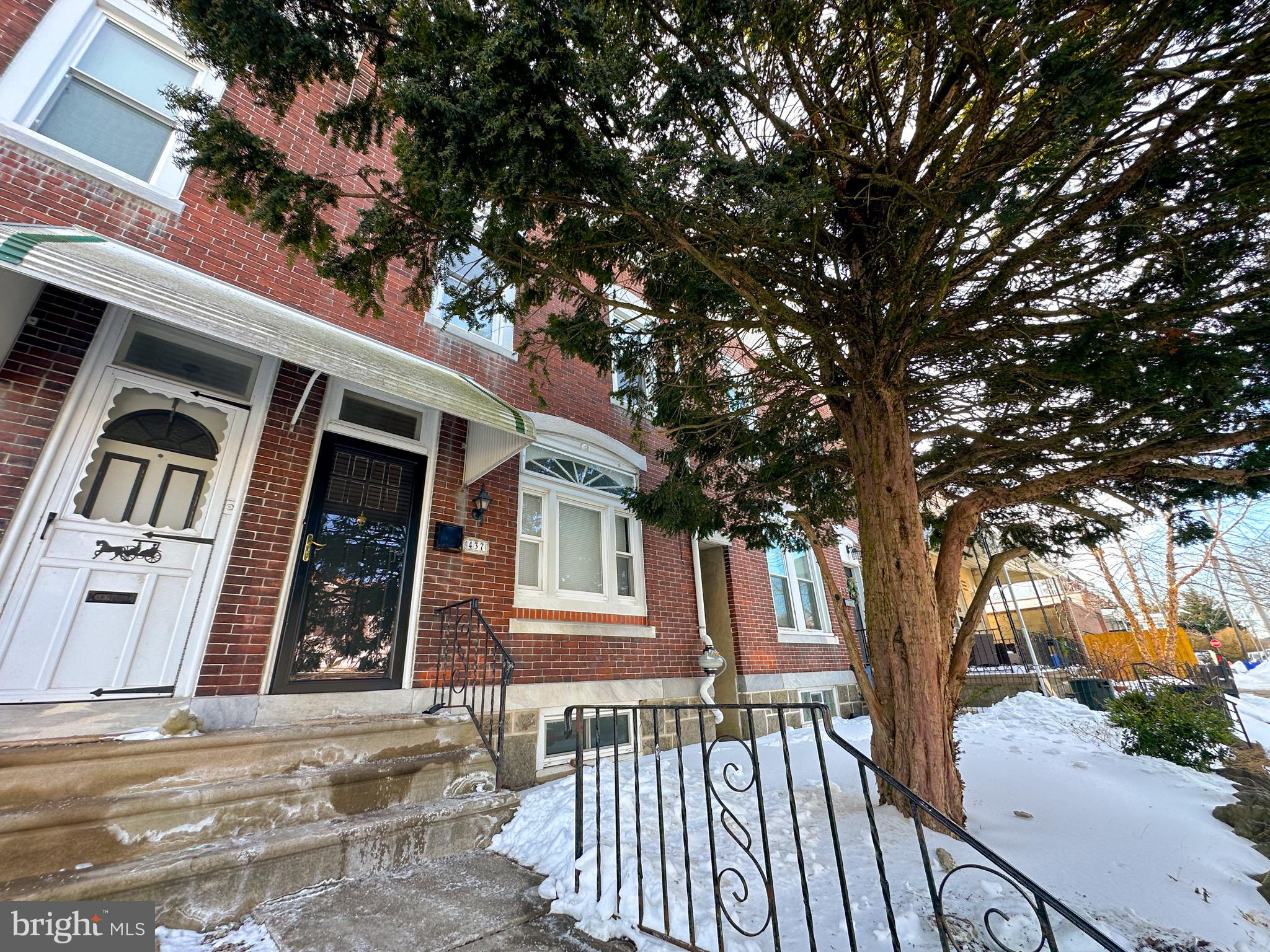 437 Markle Street Philadelphia, PA 19128 - Photo 20 of 20 a view of a brick house with a large windows