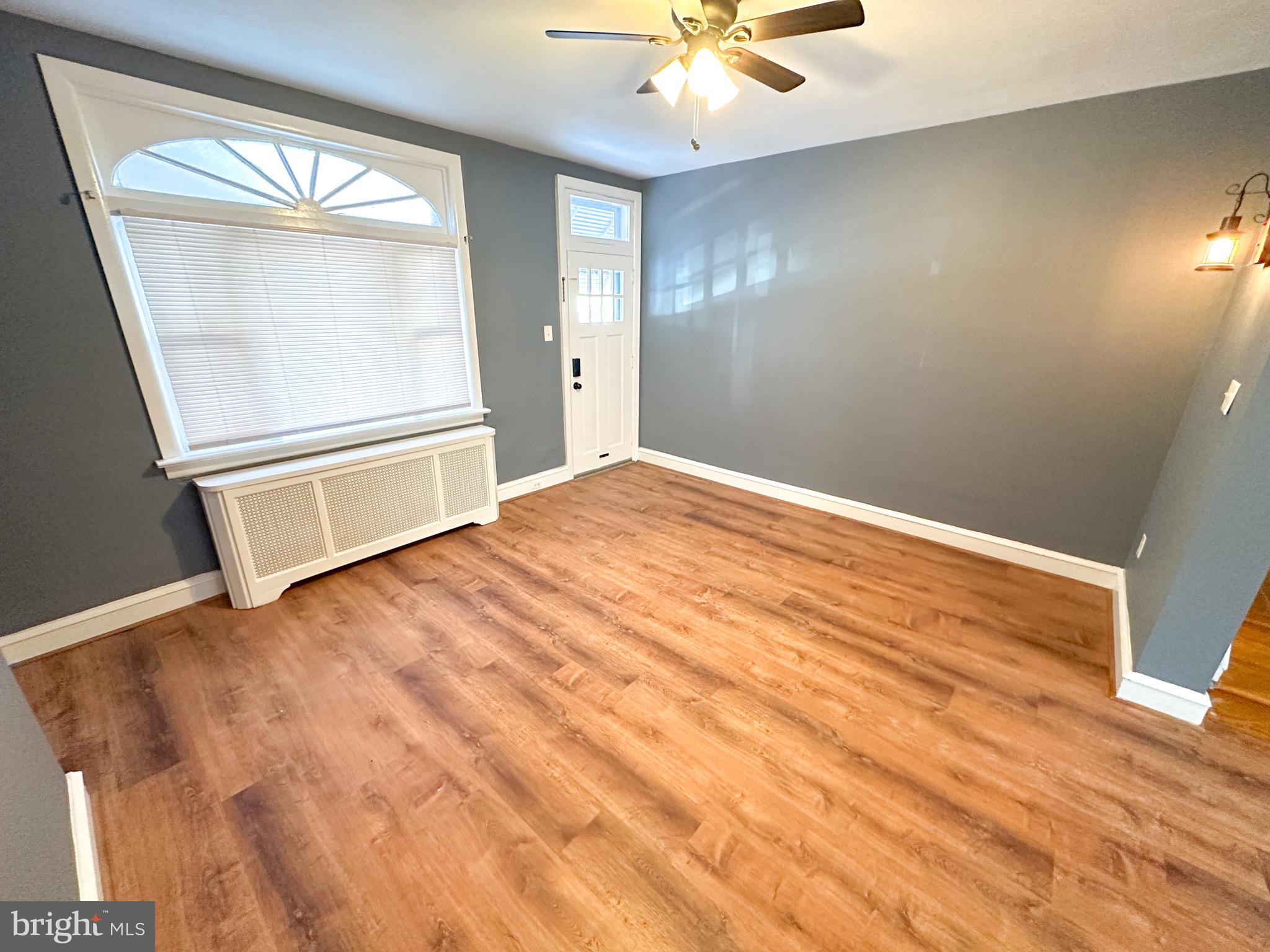 437 Markle Street Philadelphia, PA 19128 - Photo 7 of 20 a view of an empty room with wooden floor and a window