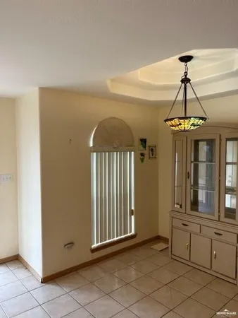 a view of a hallway with windows