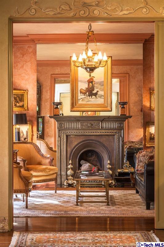 1126 Hillcrest Avenue Pasadena, CA 91106 - Photo 11 of 67 a living room with a fireplace and a chandelier