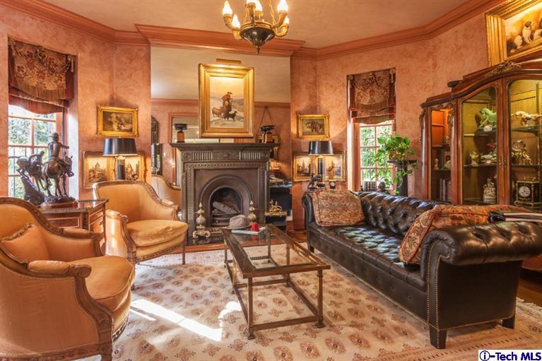 1126 Hillcrest Avenue Pasadena, CA 91106 - Photo 12 of 67 a living room with furniture a fireplace and a floor to ceiling window