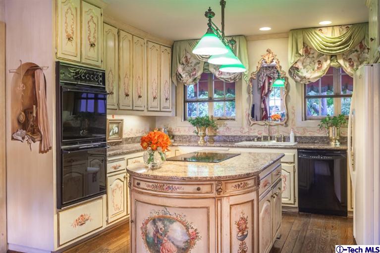 1126 Hillcrest Avenue Pasadena, CA 91106 - Photo 21 of 67 a kitchen with stainless steel appliances granite countertop a sink and a refrigerator