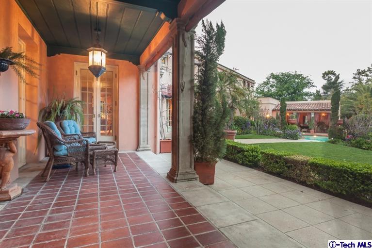 1126 Hillcrest Avenue Pasadena, CA 91106 - Photo 53 of 67 a view of a patio with a dining table and chairs with wooden floor