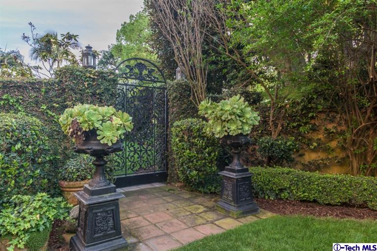 1126 Hillcrest Avenue Pasadena, CA 91106 - Photo 58 of 67 a view of a garden with a fountain