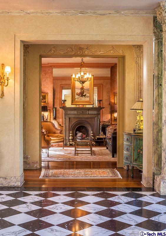 1126 Hillcrest Avenue Pasadena, CA 91106 - Photo 10 of 67 a living room with a fireplace a clock and a rug