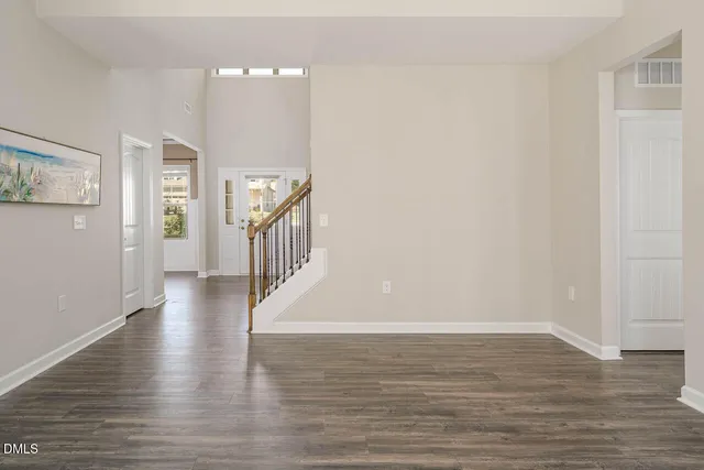 a view of an entryway with wooden floor