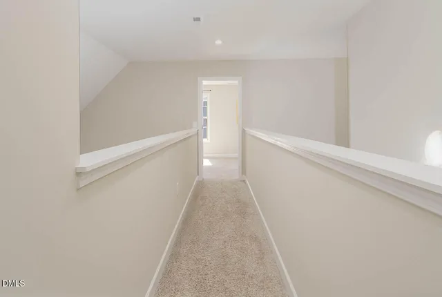 a view of a hallway with white walls