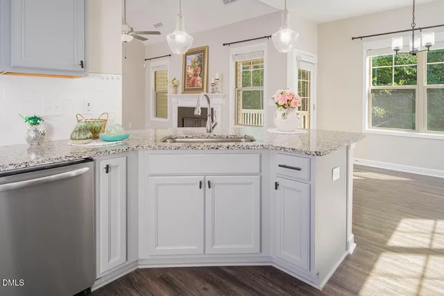 a spacious bathroom with a granite countertop sink and a mirror