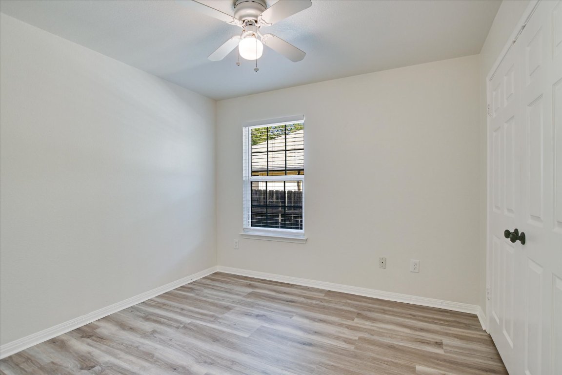 3407 Blumie Street, Unit B Austin, TX 78745 - Photo 7 of 10 wooden floor in an empty room with a window