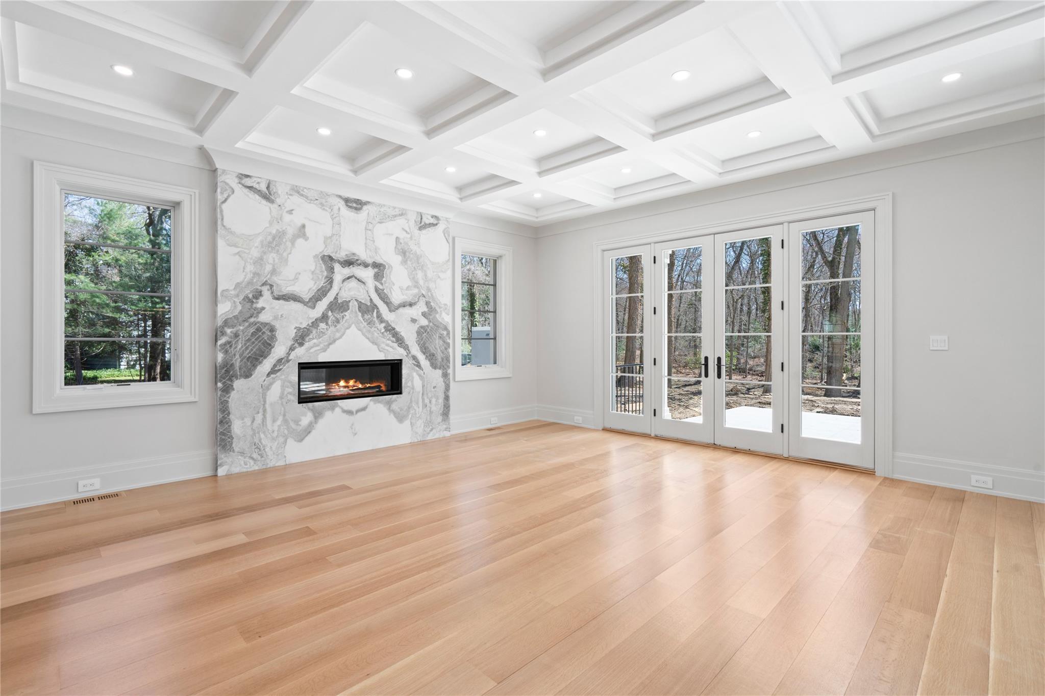 20 Knollwood Road Muttontown, NY 11545 - Photo 12 of 41 Open-concept family room with marble-encased fireplace