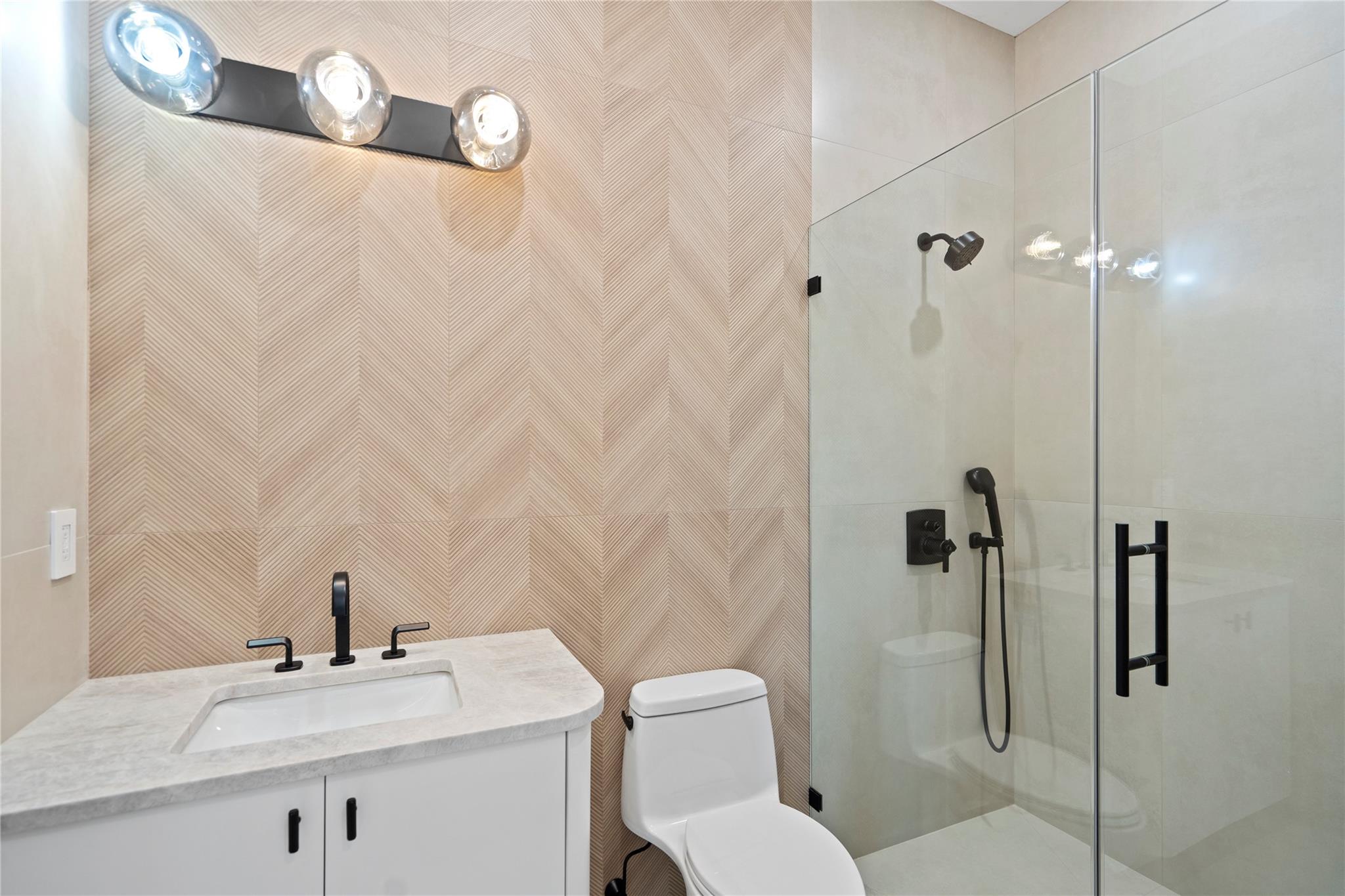 20 Knollwood Road Muttontown, NY 11545 - Photo 29 of 41 Bathroom featuring toilet, vanity, and a stall shower