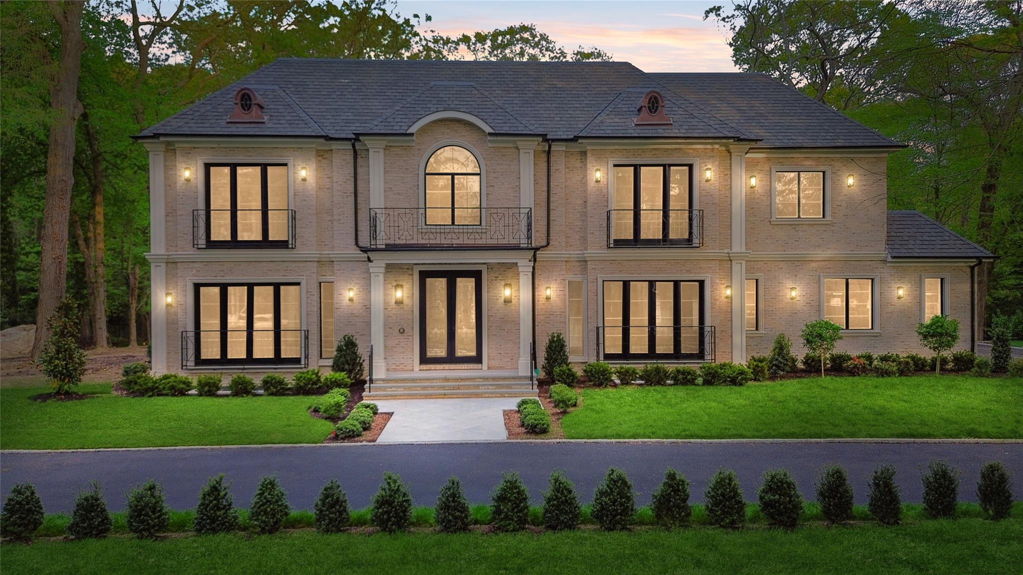20 Knollwood Road Muttontown, NY 11545 - Photo 35 of 41 French country home featuring a lawn, brick siding, and french doors