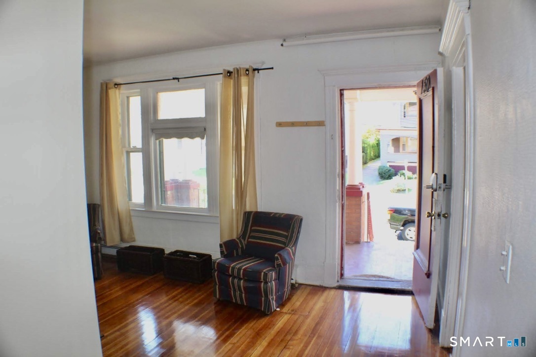 150 Whitney Street Hartford, CT 06105 - Photo 18 of 39 a living room with furniture and wooden floor