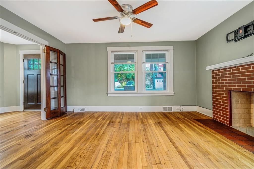 200 Spring Avenue Pittsburgh, PA 15202 - Photo 14 of 43 an empty room with wooden floor closet and windows