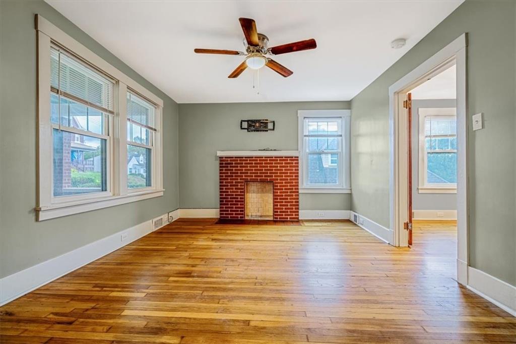 200 Spring Avenue Pittsburgh, PA 15202 - Photo 15 of 43 a view of an empty room with a window and wooden floor
