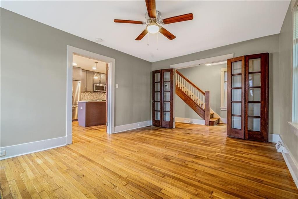 200 Spring Avenue Pittsburgh, PA 15202 - Photo 17 of 43 a view of an empty room with a window and wooden floor