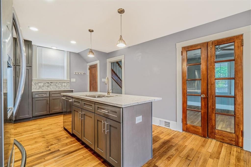 200 Spring Avenue Pittsburgh, PA 15202 - Photo 24 of 43 a kitchen with stainless steel appliances granite countertop a stove and a sink