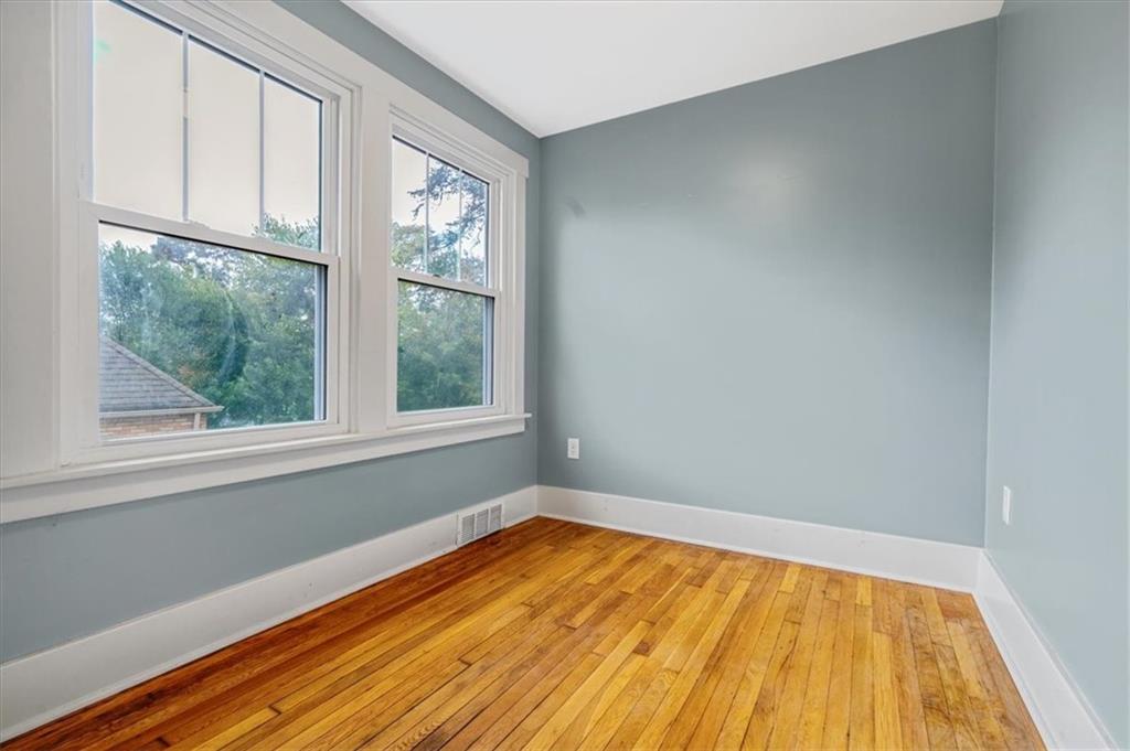 200 Spring Avenue Pittsburgh, PA 15202 - Photo 25 of 43 an empty room with wooden floor and windows