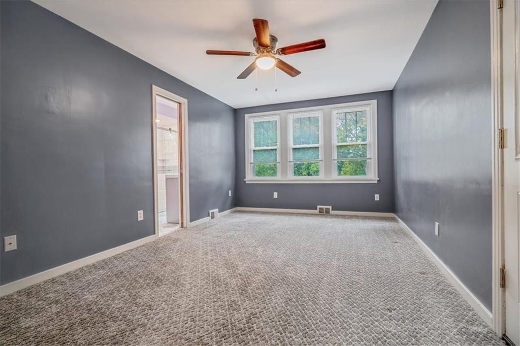 200 Spring Avenue Pittsburgh, PA 15202 - Photo 27 of 43 an empty room with ceiling fan and windows