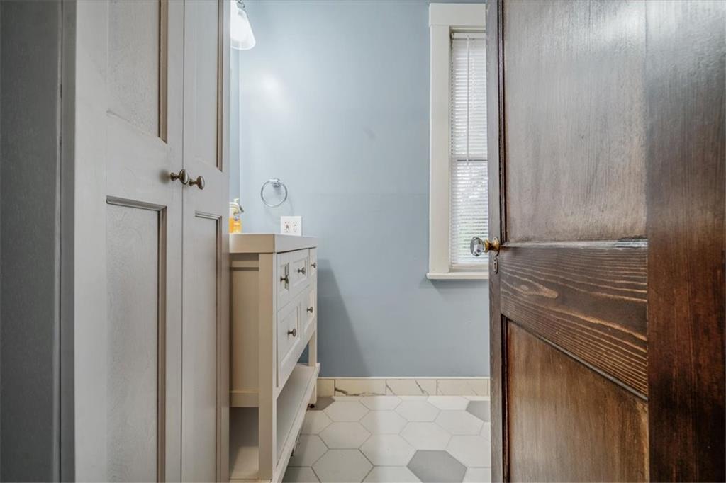 200 Spring Avenue Pittsburgh, PA 15202 - Photo 35 of 43 a bathroom with a granite countertop sink a toilet and shower