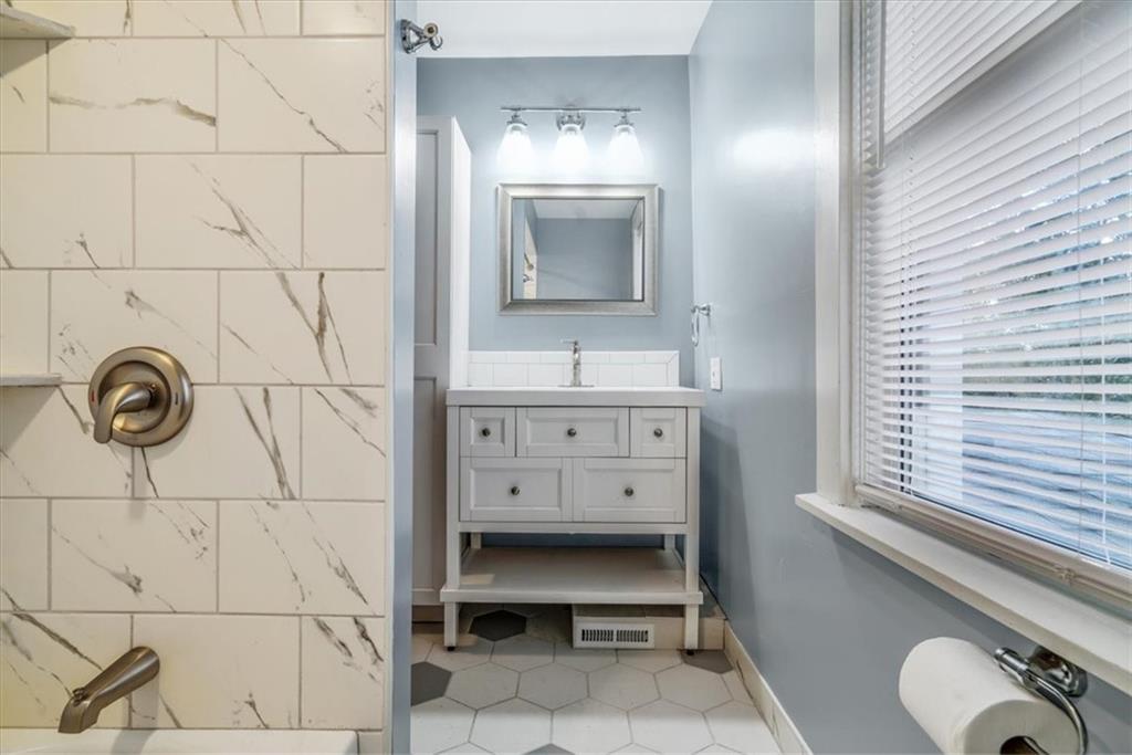 200 Spring Avenue Pittsburgh, PA 15202 - Photo 37 of 43 a bathroom with a sink and a mirror