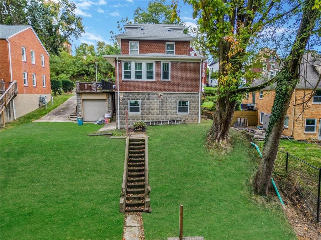 200 Spring Avenue Pittsburgh, PA 15202 - Photo 6 of 43 a front view of a house with a yard
