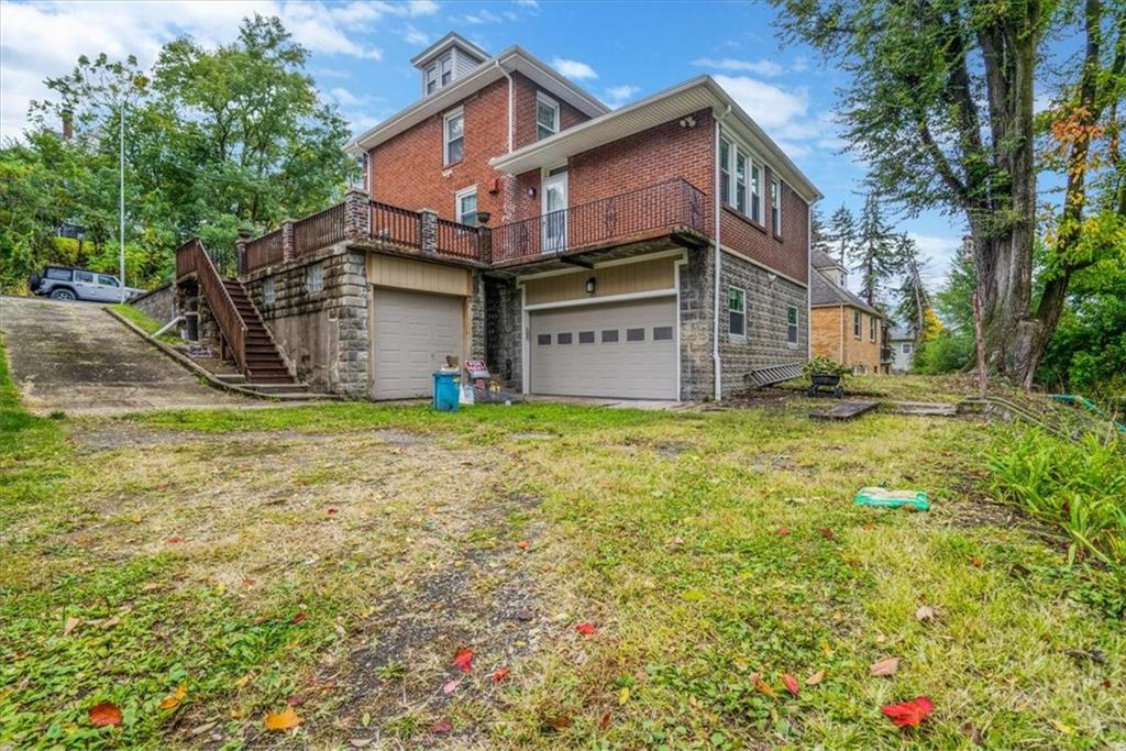 200 Spring Avenue Pittsburgh, PA 15202 - Photo 7 of 43 a view of a house with a big yard and large tree