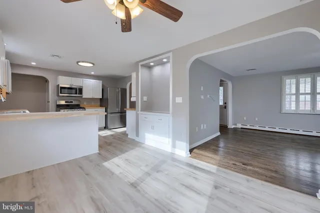 a view of a kitchen with a sink and dishwasher cabinets