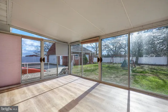 a porch with a garden view