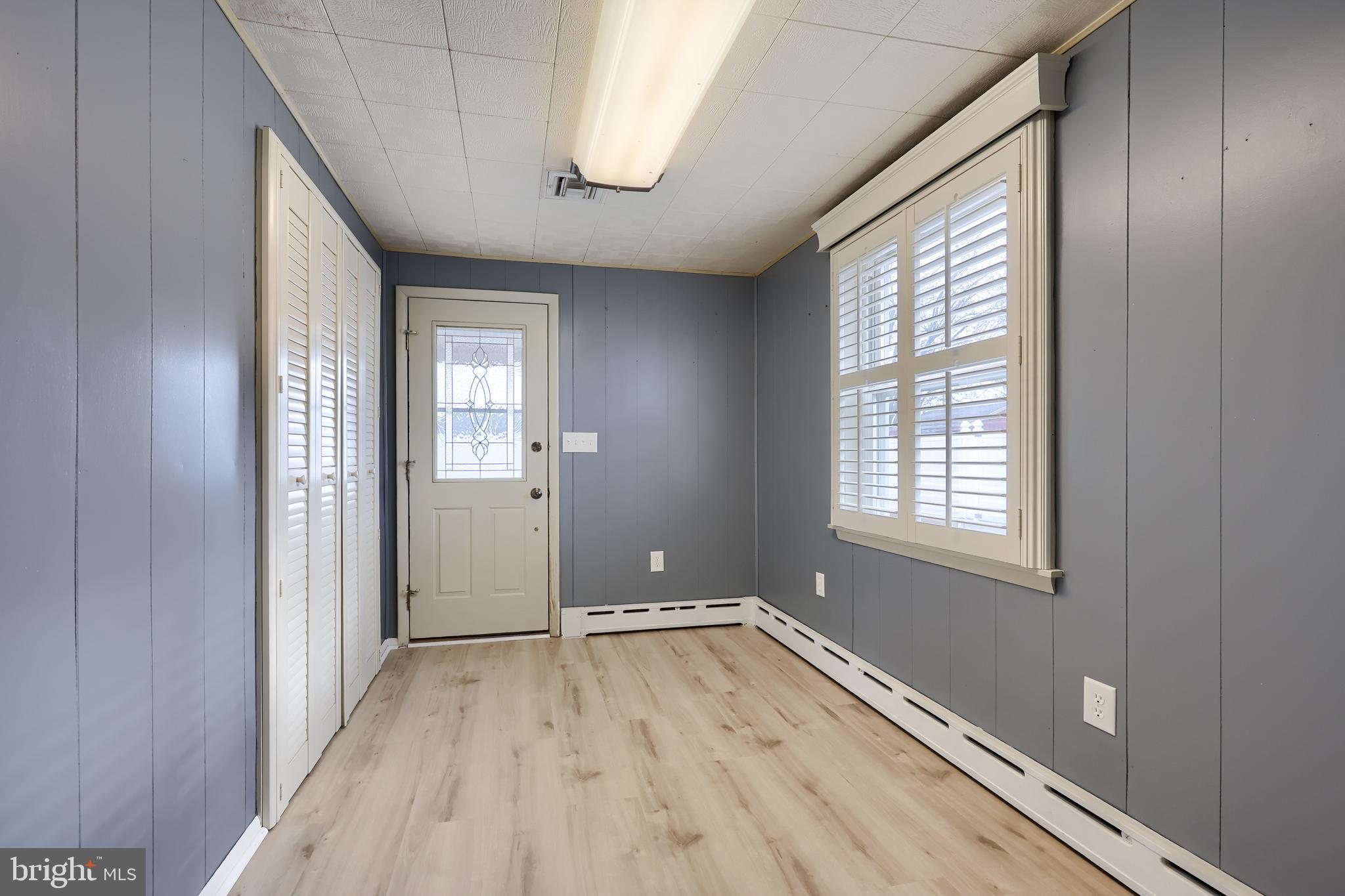 705 Summit Drive Dallastown, PA 17313 - Photo 20 of 50 a view of an empty room with wooden floor and a window