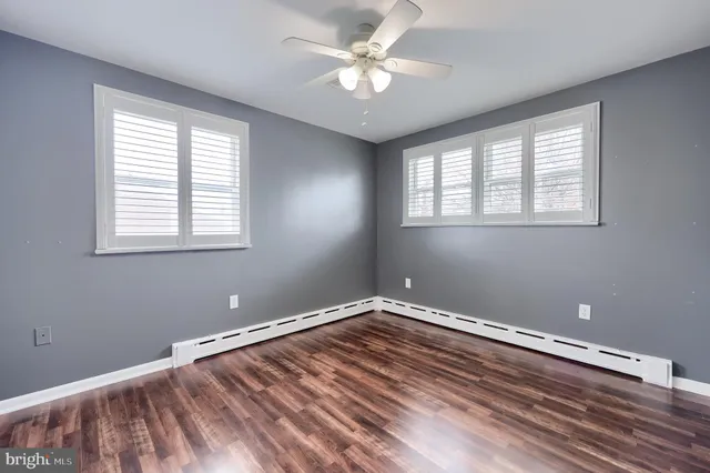 a view of room with window and ceiling fan