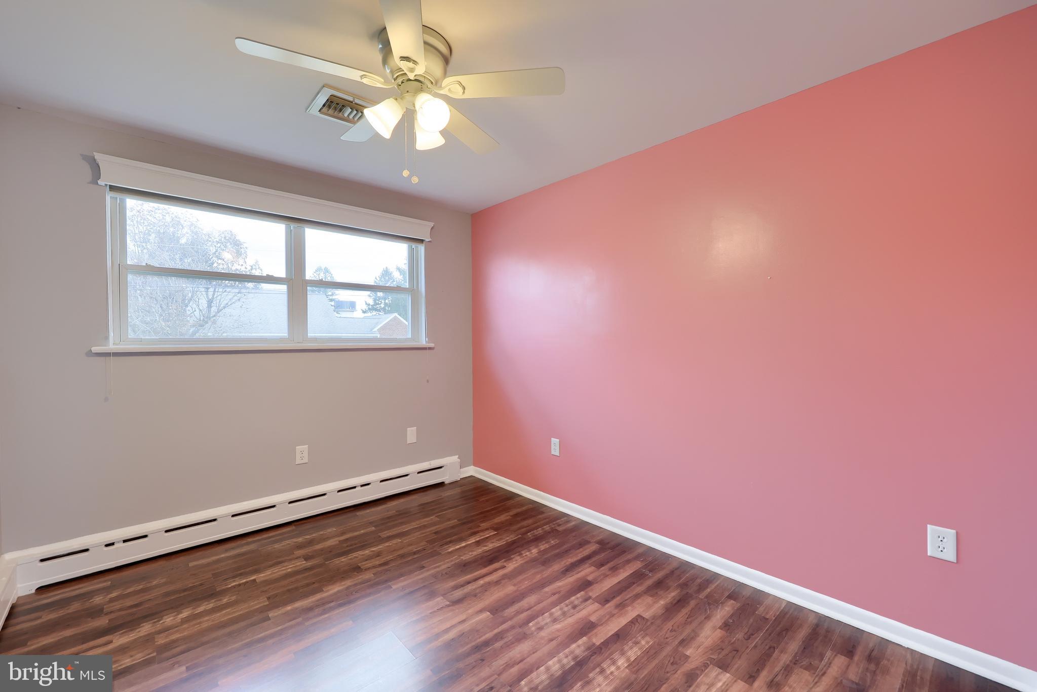 705 Summit Drive Dallastown, PA 17313 - Photo 26 of 50 wooden floor in an empty room with a window