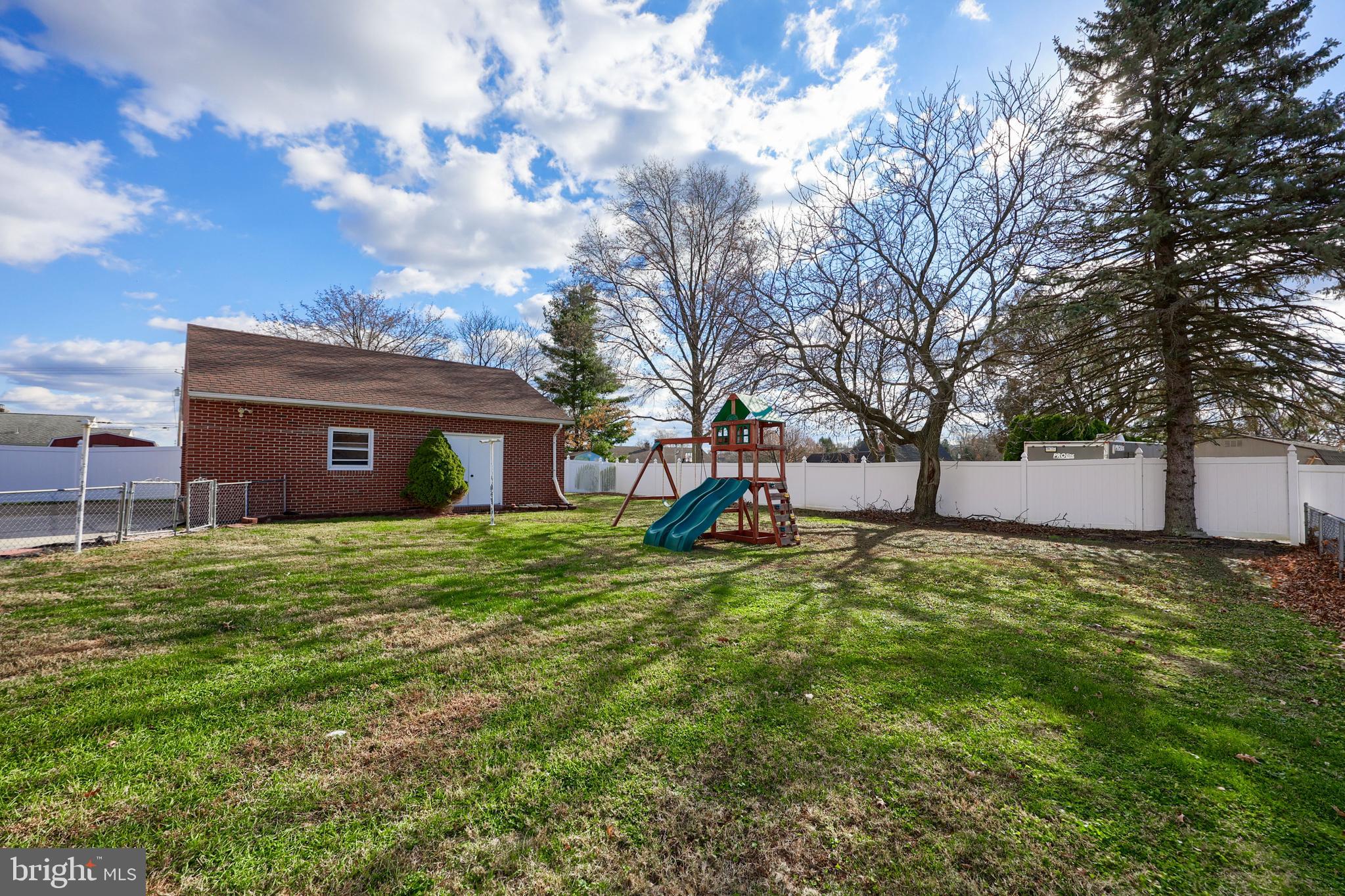 705 Summit Drive Dallastown, PA 17313 - Photo 40 of 50 a view of a backyard with a large tree