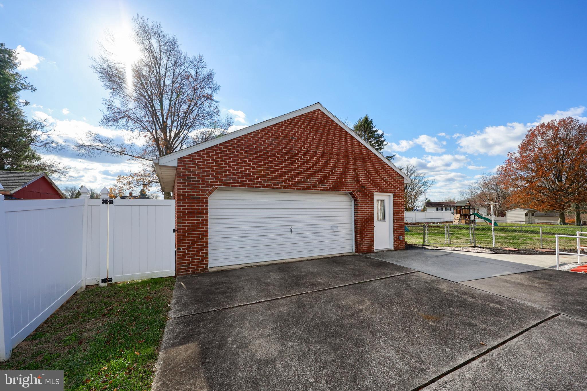 705 Summit Drive Dallastown, PA 17313 - Photo 4 of 50 a front view of a house with a yard and garage