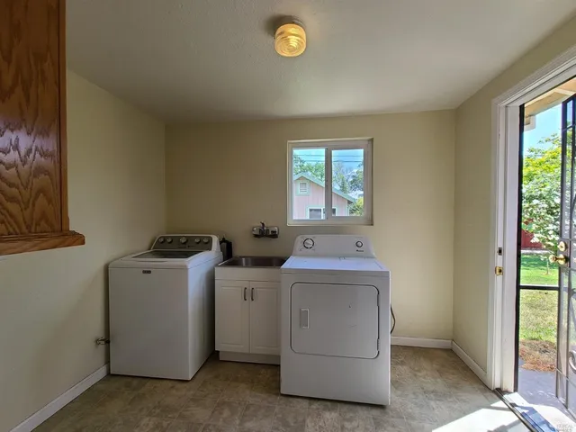 a utility room with dryer and washer
