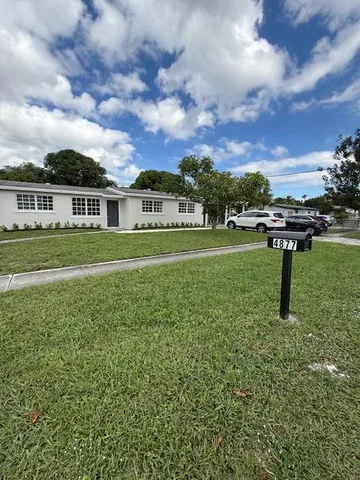 a house view with a garden space