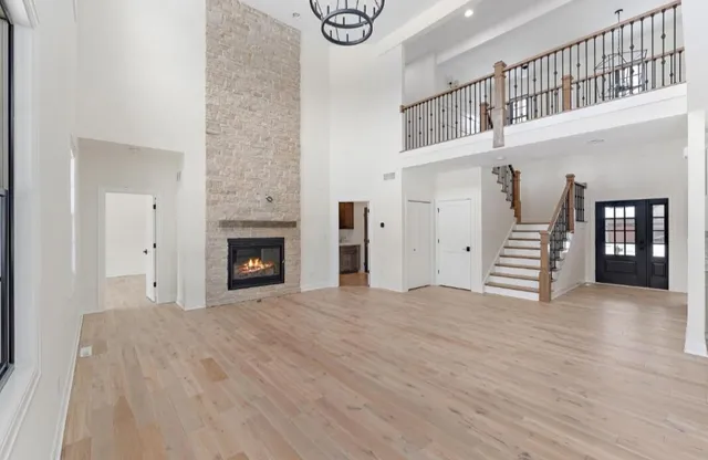 a kitchen with stainless steel appliances cabinets and wooden floor