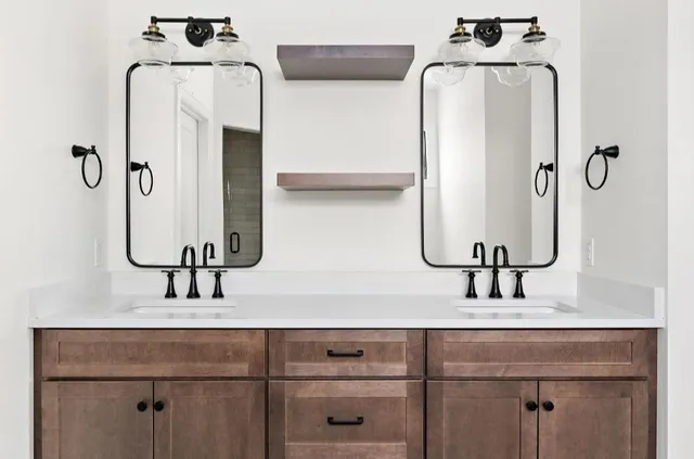 a bathroom with a bathtub and chandelier