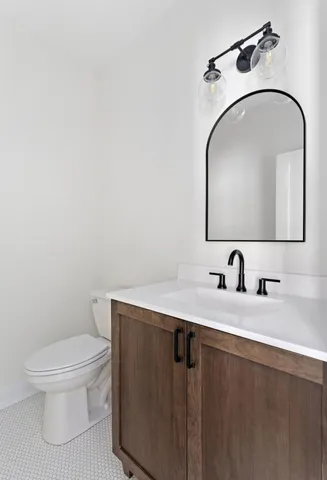 an empty room with windows and cabinet