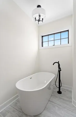 a view of empty room with ceiling fan