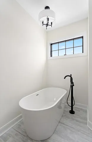 a view of empty room with ceiling fan