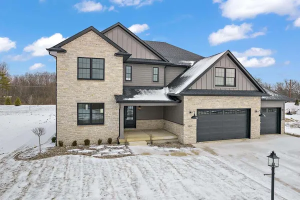 a front view of a house with yard