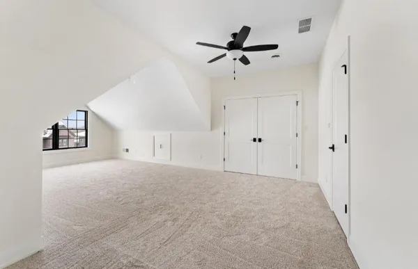 a bathroom with a granite countertop toilet a sink and a mirror