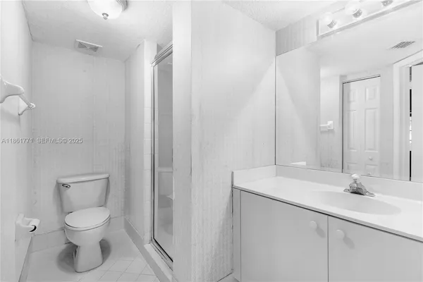 a bathroom with a sink toilet and vanity