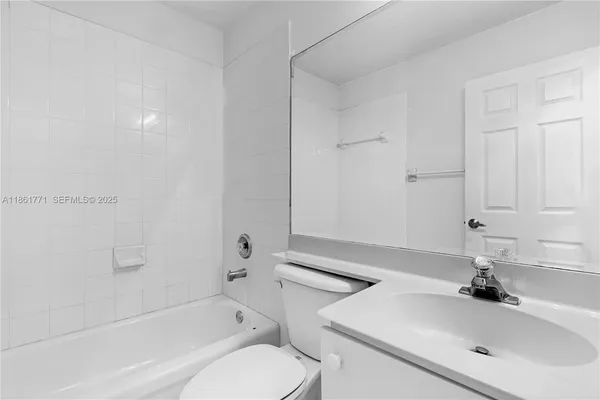a bathroom with a sink a toilet and bathtub